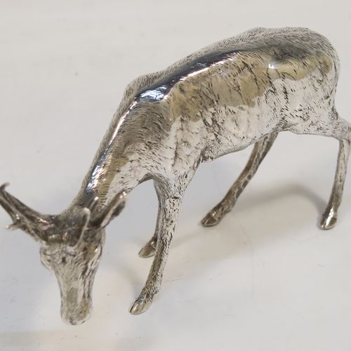 A very handsome Antique Edwardian Sterling Silver pair of solid cast deer, showing a male stag and female doe in realistic traditional poses, all finely detailed with hand-chased bodies. This  beautiful pair of silver deer were originally made on the Continent and imported with full hallmarks for London in 1902. The dimensions of these fine hand-made sterling silver deer are height of male stag  7.5 cms (3 inches), length of female doe 12 cms (4.75 inches), and they weigh a total approx. 275g (8.9 troy ounces).   