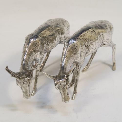 A very handsome Antique Edwardian Sterling Silver pair of solid cast deer, showing a male stag and female doe in realistic traditional poses, all finely detailed with hand-chased bodies. This  beautiful pair of silver deer were originally made on the Continent and imported with full hallmarks for London in 1902. The dimensions of these fine hand-made sterling silver deer are height of male stag  7.5 cms (3 inches), length of female doe 12 cms (4.75 inches), and they weigh a total approx. 275g (8.9 troy ounces).   