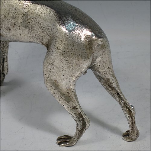 A large cast 800 Standard Silver model of a Doberman Pinscher dog, having a realistically hand-chased body. Made in Europe in ca. 1910. The dimensions of this fine hand-made 800 standard silver Doberman Pinscher dog model are height 17 cms (6.75 inches), length 19 cms (7.5 inches), width 5 cms (2.5 inches), and it weighs approx. 430g (13.9 troy ounces).    
