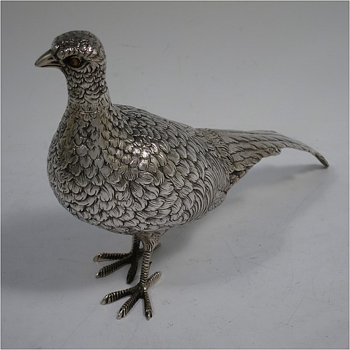 A very handsome pair of Dutch Continental 833 standard Silver pheasants, showing a male and female bird in realistic traditional poses, finely detailed with hand-chased bodies and tail feathers, and with removable heads. Made in Holland in 1948. The dimensions of these fine hand-made silver pheasants are length of male bird 26 cms (10.25 inches), height 12.5 cms (5 inches), and they weigh a total approx. 413g (13.3 troy ounces).    