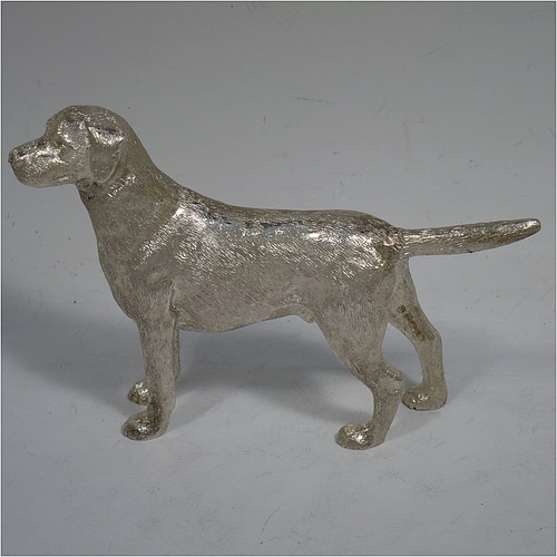A very handsome Sterling Silver cast model of a male Labrador gun dog, having a realistically hand-chased body. Made in London in 2016. The dimensions of this fine hand-made cast sterling silver Labrador dog model are height 8.5 cms (3.3 inches), length 12.5 cms (5 inches), width 2.5 cms (1 inch), and it weighs approx. 275g (8.9 troy ounces).