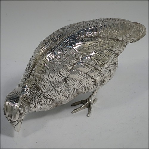 A very handsome and large pair of Antique Edwardian Silver-Plated partridge bird models, having realistically hand-chased feathers, faces, and feet. Made in ca. 1910 in England. The dimensions of this fine hand-made antique silver plated pair of partridge model birds are height 16.5 cms (6.5 inches), length 19 cms (7.5 inches), and width 7.5 cms (3 inches).