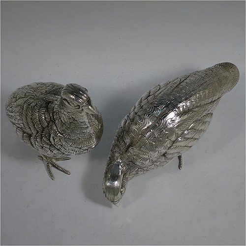 A very handsome and large pair of Antique Edwardian Silver-Plated partridge bird models, having realistically hand-chased feathers, faces, and feet. Made in ca. 1910 in England. The dimensions of this fine hand-made antique silver plated pair of partridge model birds are height 16.5 cms (6.5 inches), length 19 cms (7.5 inches), and width 7.5 cms (3 inches).