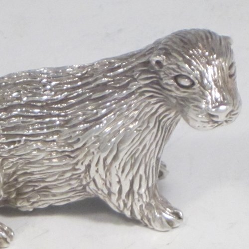 Sterling silver cast model of an otter, having a realistically hand-chased fur body. Made in London in 1993. The dimensions of this fine hand-made silver otter model are length 10 cms (4 inches), height 3.5 cms (1.3 inches), and it weighs approx. 196g (6.3 troy ounces).