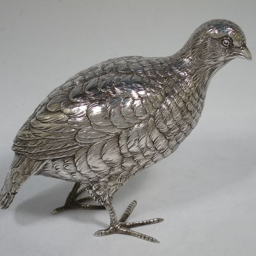 A very handsome and large pair of Sterling Silver partridge bird models, having realistically hand-chased feathers, faces, and feet. Bearing Import marks for London 1934. The dimensions of this fine hand-made sterling silver pair of partridge model birds are height 14 cms (5.5 inches), length 20 cms (8 inches), width 8 cms (3 inches), and they weigh a total of approx. 753g (24 troy ounces).