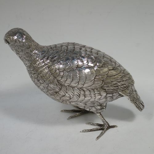 A very handsome and large pair of Sterling Silver partridge bird models, having realistically hand-chased feathers, faces, and feet. Bearing Import marks for London 1934. The dimensions of this fine hand-made sterling silver pair of partridge model birds are height 14 cms (5.5 inches), length 20 cms (8 inches), width 8 cms (3 inches), and they weigh a total of approx. 753g (24 troy ounces).