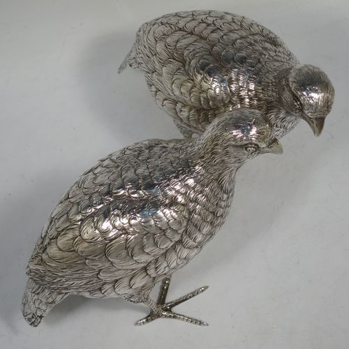 A very handsome and large pair of Sterling Silver partridge bird models, having realistically hand-chased feathers, faces, and feet. Bearing Import marks for London 1934. The dimensions of this fine hand-made sterling silver pair of partridge model birds are height 14 cms (5.5 inches), length 20 cms (8 inches), width 8 cms (3 inches), and they weigh a total of approx. 753g (24 troy ounces).