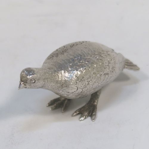 A handsome Sterling Silver solid cast model of a partridge bird, in a pose and having realistically hand-chased feathers. This elegant silver partridge model was made by Robert Comyns of London in 1971. The dimensions of this fine hand-made silver partridge model are height 3.5 cms (1.3 inches), length 7.5 cms (3 inches), width 3 cms (1.25 inches), and it weighs approx. 51g (1.6 troy ounces).