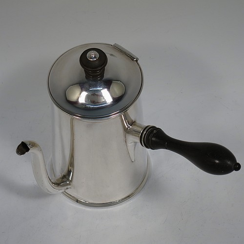 A very handsome Antique Victorian Sterling Silver gravy Argyll, having a plain round body with tapering sides and applied reeded borders, a domed hinged lid with wooden finial, a scroll pouring spout, a wooden handle that unscrews to reveal an opening for adding hot water to the water jacket, and all sitting on a flat base. Made D. and J. Welby of London in 1887. The dimensions of this fine hand-made antique silver Argyll are height 15 cms (6 inches), diameter at base 8.5 cms (3.3 inches), length 12 cms (4.75 inches), and it weighs approx. 350g (11.3 troy ounces).