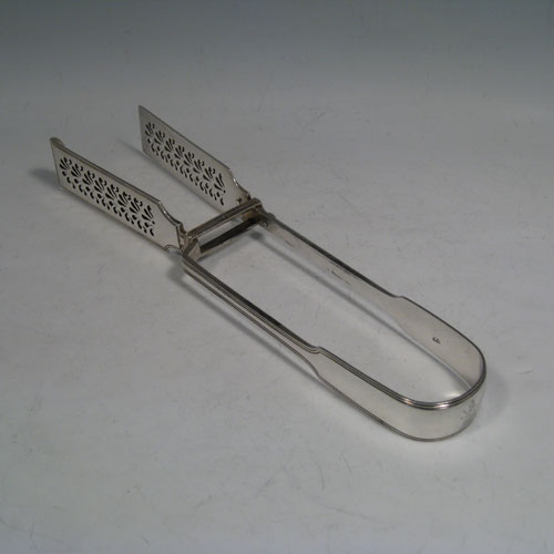 Antique Victorian sterling silver Fiddle and Thread pattern pair of asparagus serving tongs, having hand-pierced blades, and original retaining guard with screws. Made by Mary Chawner of London in 1838. The dimensions of this fine pair of antique silver asparagus servers are length 26 cms (10.25 inches), and they weigh approx. 215g (6.9 troy ounces). Please note that this item is crested.
