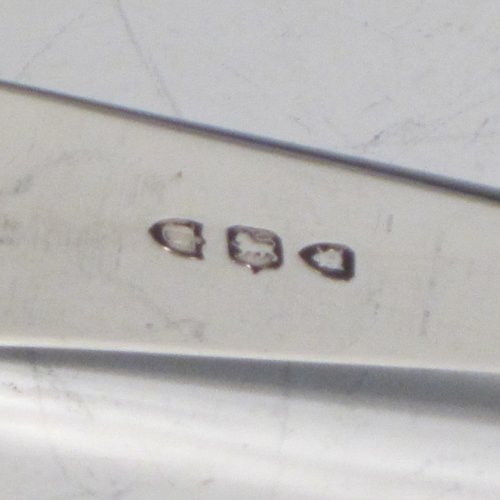 Antique Victorian sterling silver Old English pattern pair of asparagus serving tongs, having hand-pierced blades, and original retaining guard with screws. Made by William Hutton of London in 1895. The dimensions of this fine pair of antique silver asparagus servers are length 22.5 cms (8.75 inches), and they weigh approx. 122g (4 troy ounces).
