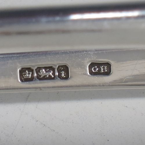 A handsome Antique Victorian Sterling Silver pair of large asparagus serving tongs, in the Old English and Shell pattern, having hand-pierced blades with hand-engraved reeded decoration, and original retaining guard with screw. Made by George Hancock of Sheffield in 1901. The dimensions of this fine hand-made pair of antique silver asparagus servers are length 23 cms (9 inches), and they weigh approx. 142g (4.5 troy ounces).