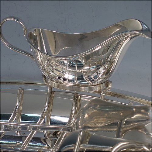 A Silver Plated asparagus serving set, having a plain oval body, with an applied rounded border, an original wire-work serving rack, a pair of plain serving tongs, and a sauce boat sat in a frame with loop handle, and all sitting on a flat base. Made by Deakin & Frances of Sheffield in ca. 1920. The dimensions of this fine hand-made silver-plated asparagus serving set are length 30.5 cms (12 inches), and width, 19.5 cms (7.75 inches).