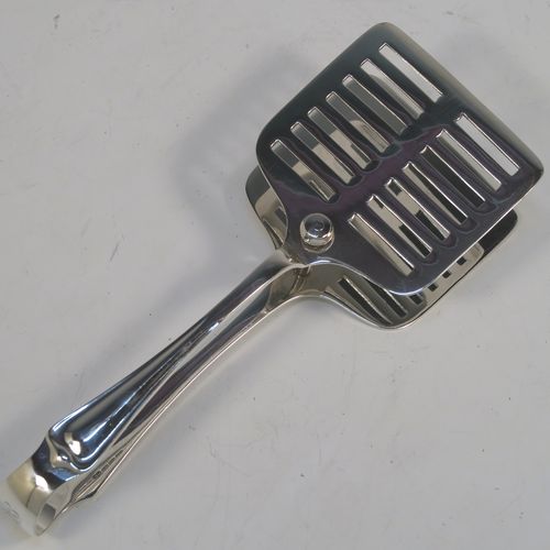 An Antique Edwardian Silver Plated asparagus serving set, having a plain rectangular body, with a wire-work serving rack, and a pair of asparagus server tongs, and all sitting on a flat base. This beautiful asparagus server set was made by the Atkins Brothers of Sheffield in ca. 1910. The dimensions of this fine hand-made silver-plated asparagus serving set are length 30.5 cms (12 inches), and width, 24 cms (9.5 inches). Please note that the asparagus servers are monogrammed, and the base has very light scratches, but everything else is in very good original condition, with no plate wearing off.