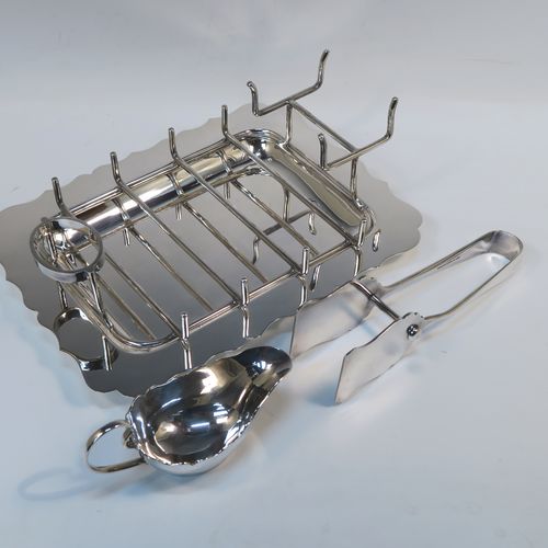 A very elegant Antique Edwardian Silver Plated asparagus serving set, having a plain rectangular body with a Chippendale border, a wire-work serving rack, a sauce boat sat in a frame with loop handle, a pair of asparagus server tongs, and all sitting on a flat base. This handsome silver-plated asparagus serving set was made made by Gladwins Ltd., of Sheffield in ca. 1910. The dimensions of this fine hand-made silver-plated asparagus serving set are length 28 cms (11 inches), and width, 21 cms (8.25 inches).
