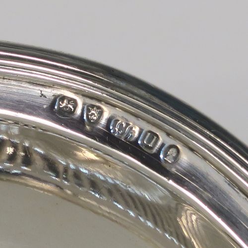 A very handsome Antique Georgian Sterling Silver basket, having an oval body with an applied reeded border, with hand-chased fluted decoration, a hinged and reeded swing handle, all sitting on a plain oval collet foot. This elegant antique silver basket was made by Joseph Scammell of London in 1795. The dimensions of this fine hand-made antique silver basket are height 28 cms (11 inches), length 37 cms (14.5 inches), width 26 cms (10.25 inches), and it weighs approx. 899g (29 troy ounces). Please note that this basket is crested.