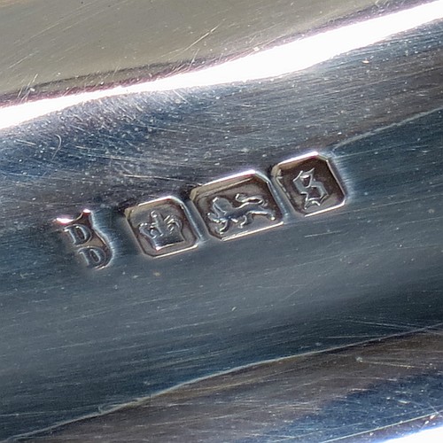An Antique Edwardian Sterling Silver basket, having a rectangular body, with an applied gadroon border, a hinged and swing handle with gadroon edges, all sitting on a pedestal foot. Made by the Dixon Brothers of Sheffield in 1910. The dimensions of this fine hand-made antique silver basket are height 23 cms (9 inches), length 27.5 cms (10.75 inches), width 21 cms (8.25 inches), and it weighs approx. 746g (24 troy ounces).