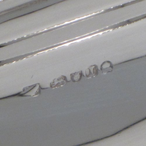 Antique Georgian sterling silver basket, having a rectangular body, with applied gadroon borders, a band of hand-engraved floral work, a central cartouche with matching engraving, a hinged and swing handle, all sitting on a pedestal foot. Made by David and Robert Hennell (Poss.) of London in 1804. The dimensions of this fine hand-made silver basket are height 25 cms (10 inches), length 31 cms (12.25 inches), width 24 cms (9.5 inches), and it weighs approx. 1,021g (33 troy ounces).
