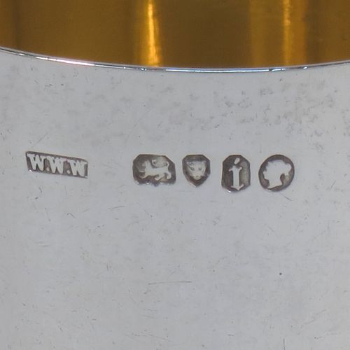 A very elegant Antique Victorian Sterling Silver beaker cup, having a very plain round body with tapering sides, sitting on a flat base, and with a gold-gilt interior. Made by Williams, Wrangham, and Withams of London in 1864. The dimensions of this fine hand-made antique silver beaker cup are height 9 cms (3.5 inches), diameter at top 7.5 cms (3 inches), and it weighs approx. 153g (4.9 troy ounces).