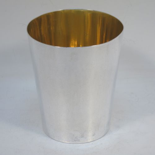 A very elegant Antique Victorian Sterling Silver beaker cup, having a very plain round body with tapering sides, sitting on a flat base, and with a gold-gilt interior. Made by Williams, Wrangham, and Withams of London in 1864. The dimensions of this fine hand-made antique silver beaker cup are height 9 cms (3.5 inches), diameter at top 7.5 cms (3 inches), and it weighs approx. 153g (4.9 troy ounces).