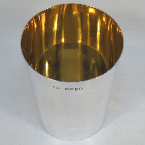 A very elegant Antique Victorian Sterling Silver beaker cup, having a very plain round body with tapering sides, sitting on a flat base, and with a gold-gilt interior. Made by Williams, Wrangham, and Withams of London in 1864. The dimensions of this fine hand-made antique silver beaker cup are height 9 cms (3.5 inches), diameter at top 7.5 cms (3 inches), and it weighs approx. 153g (4.9 troy ounces).