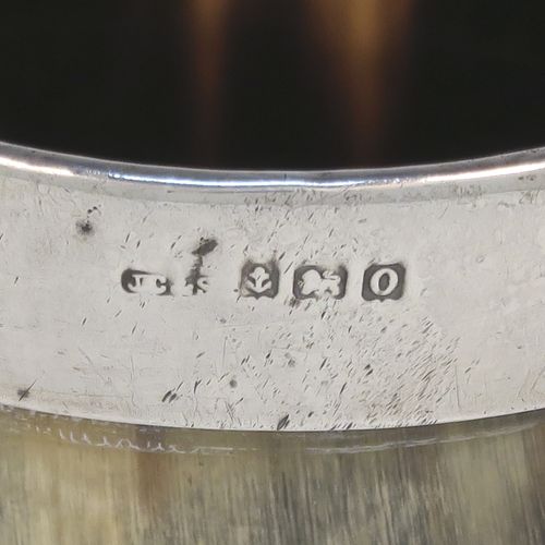 A rare and handsome Antique Sterling Silver and horn beaker cup, having a very plain round horn-mounted body with tapering sides, an applied top silver band around the lip, an applied central shield style vacant cartouche, and all sitting on a flat base. This elegant silver and horn beaker was made by John Grinsell and Sons of Birmingham in 1913. The dimensions of this fine hand-made antique horn and silver beaker cup are height 13cms (5 inches), and diameter at top 7 cms (2.75 inches).