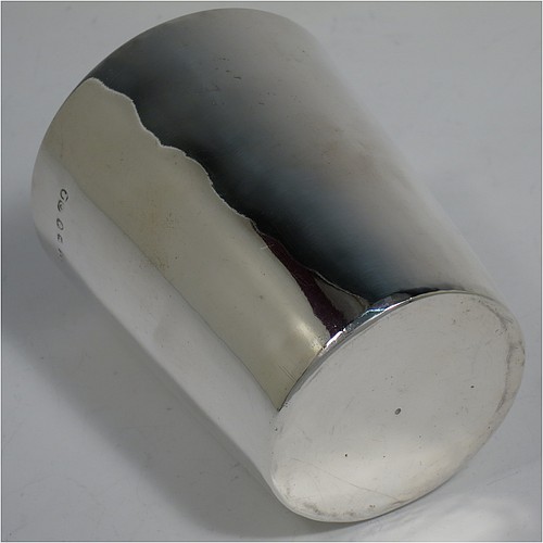 A very handsome Antique Georgian Sterling Silver beaker cup, having a very plain round body with tapering sides, sitting on a flat base, and with a gold-gilt interior. Made by Philip Batchelor (poss.) of London in 1789. The dimensions of this fine hand-made antique silver beaker cup are height 9 cms (3.5 inches), diameter at top 7.5 cms (3 inches), and it weighs approx. 116g (3.7 troy ounces).