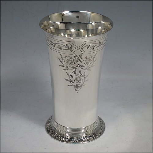 A Sterling Silver beaker in a 17th Century Charles I style, having a round straight-sided body with tapering sides, with hand-engraved floral work, all sitting on a hand-chased collet foot with an applied reeded band above. Made by Robert Frederick Fox of London in 1917. The dimensions of this fine hand-made silver beaker are height 13 cms (5 inches), diameter at top 8 cms (3 inches), and it weighs approx. 226g (7.3 troy ounces).   