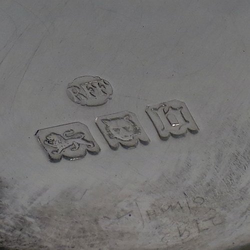 A Sterling Silver beaker in a 17th Century Charles I style, having a round straight-sided body with tapering sides, with hand-engraved floral work, all sitting on a hand-chased collet foot with an applied reeded band above. Made by Robert Frederick Fox of London in 1917. The dimensions of this fine hand-made silver beaker are height 13 cms (5 inches), diameter at top 8 cms (3 inches), and it weighs approx. 226g (7.3 troy ounces).