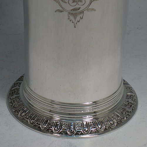 A Sterling Silver beaker in a 17th Century Charles I style, having a round straight-sided body with tapering sides, with hand-engraved floral work, all sitting on a hand-chased collet foot with an applied reeded band above. Made by Robert Frederick Fox of London in 1917. The dimensions of this fine hand-made silver beaker are height 13 cms (5 inches), diameter at top 8 cms (3 inches), and it weighs approx. 226g (7.3 troy ounces).