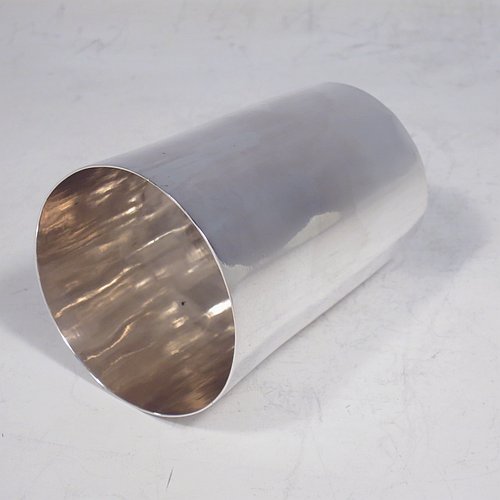 An Antique Georgian Sterling Silver beaker cup, having a very plain round body with tapering sides, and sitting on a flat base. Made by Samuel Godbehere, Edward Wigan & James Boult of London in 1811. The dimensions of this fine hand-made antique silver beaker cup are height 8 cms (3 inches), diameter at top 6 cms (2.25 inches), and it weighs approx. 90g (3 troy ounces).