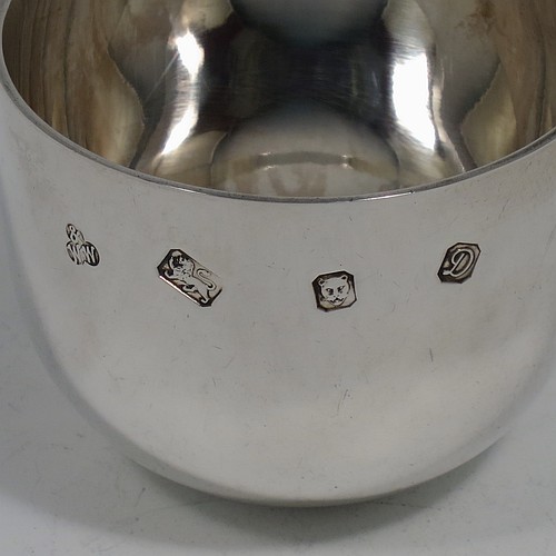 A very handsome pair of Sterling Silver tumbler cups, having plain round bodies. Made by Wakely and Wheeler of London in 1978/79. The dimensions of these fine hand-made silver tumbler cups are height 5 cms (2 inches), diameter 6.5 cms (2.5 inches), and their total weight is approx. 218g (7 troy ounces).