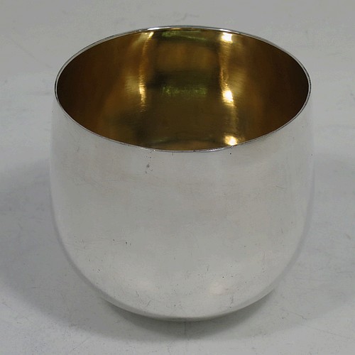 A very handsome and rare Antique Georgian Sterling Silver tumbler cup, having a plain round body, with a gold-gilt interior. Made in London in 1768. The dimensions of this fine hand-made antique silver tumbler cup are height 5.5 cms (2.25 inches), diameter 6 cms (2.25 inches), and it weighs approx. 74g (2.4 troy ounces). Please note that this item is crested.