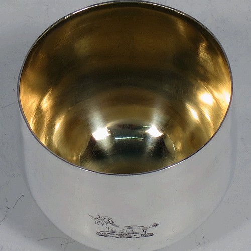 A very handsome and rare Antique Georgian Sterling Silver tumbler cup, having a plain round body, with a gold-gilt interior. Made in London in 1768. The dimensions of this fine hand-made antique silver tumbler cup are height 5.5 cms (2.25 inches), diameter 6 cms (2.25 inches), and it weighs approx. 74g (2.4 troy ounces). Please note that this item is crested.