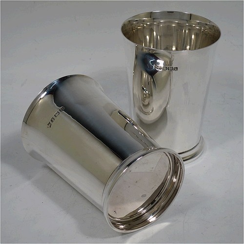 A very handsome Sterling Silver pair of beaker cups, having plain round bodies with tapering sides, and sitting on a collet foot with a reeded border. Made by S. Blanckensee and Sons of Birmingham in 1926/28. The dimensions of this fine pair of hand-made silver beakers are height 10 cms (4 inches), diameter at top 7.5 cms (3 inches), and they weigh a total of approx. 333g (10.7 troy ounces).