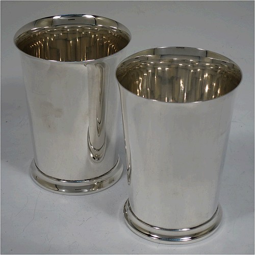 A very handsome Sterling Silver pair of beaker cups, having plain round bodies with tapering sides, and sitting on a collet foot with a reeded border. Made by S. Blanckensee and Sons of Birmingham in 1926/28. The dimensions of this fine pair of hand-made silver beakers are height 10 cms (4 inches), diameter at top 7.5 cms (3 inches), and they weigh a total of approx. 333g (10.7 troy ounces).