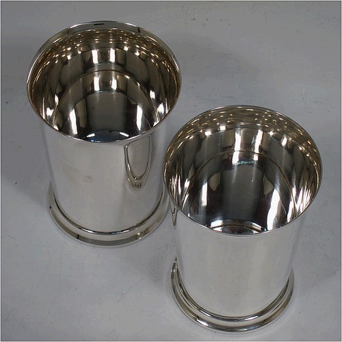 A very handsome Sterling Silver pair of beaker cups, having plain round bodies with tapering sides, and sitting on a collet foot with a reeded border. Made by S. Blanckensee and Sons of Birmingham in 1926/28. The dimensions of this fine pair of hand-made silver beakers are height 10 cms (4 inches), diameter at top 7.5 cms (3 inches), and they weigh a total of approx. 333g (10.7 troy ounces).