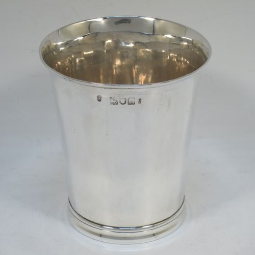 A very handsome Antique Victorian Sterling Silver beaker cup, having a very plain round body with tapering sides, and sitting on a collet foot with reeded decoration. Made by Walter and Harold Child of London in 1898. The dimensions of this fine hand-made antique silver beaker cup are height 9.5 cms (3.75 inches), diameter at top 8.5 cms (3.3 inches), and it weighs approx. 134g (4.3 troy ounces).   