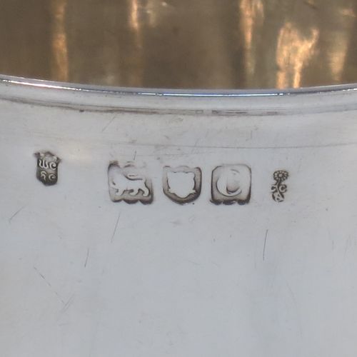 A very handsome Antique Victorian Sterling Silver beaker cup, having a very plain round body with tapering sides, and sitting on a collet foot with reeded decoration. Made by Walter and Harold Child of London in 1898. The dimensions of this fine hand-made antique silver beaker cup are height 9.5 cms (3.75 inches), diameter at top 8.5 cms (3.3 inches), and it weighs approx. 134g (4.3 troy ounces).