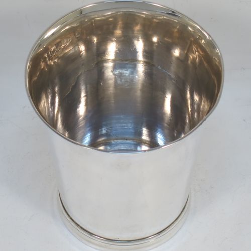 A very handsome Antique Victorian Sterling Silver beaker cup, having a very plain round body with tapering sides, and sitting on a collet foot with reeded decoration. Made by Walter and Harold Child of London in 1898. The dimensions of this fine hand-made antique silver beaker cup are height 9.5 cms (3.75 inches), diameter at top 8.5 cms (3.3 inches), and it weighs approx. 134g (4.3 troy ounces).