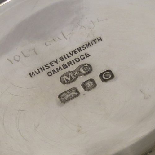A heavy and very handsome Sterling Silver beaker cup, having a plain round body with tapering flared sides, and sitting on a collet foot with an applied reeded border. This elegant silver beaker was made by Munsey and Co., of London in 1938. The dimensions of this fine hand-made silver beaker cup are height 9 cms (3.5 inches), diameter at top 9 cms (3.5 inches), and it weighs approx. 237g (7.6 troy ounces).