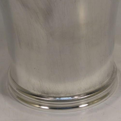 A heavy and very handsome Sterling Silver beaker cup, having a plain round body with tapering flared sides, and sitting on a collet foot with an applied reeded border. This elegant silver beaker was made by Munsey and Co., of London in 1938. The dimensions of this fine hand-made silver beaker cup are height 9 cms (3.5 inches), diameter at top 9 cms (3.5 inches), and it weighs approx. 237g (7.6 troy ounces).