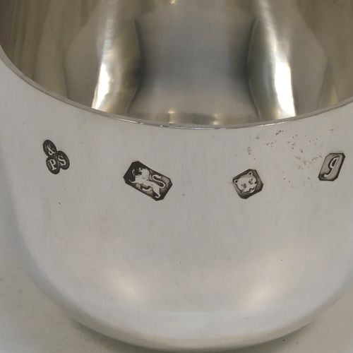 A very handsome and heavy pair of Sterling Silver tumbler cups, having plain round bodies. These beautiful silver tumbler cups were made by Payne and Son of London in 1983. The dimensions of these fine hand-made silver tumbler cups are height 5 cms (2 inches), diameter 6.5 cms (2.5 inches), and their total weight is approx. 356g (11.5 troy ounces).