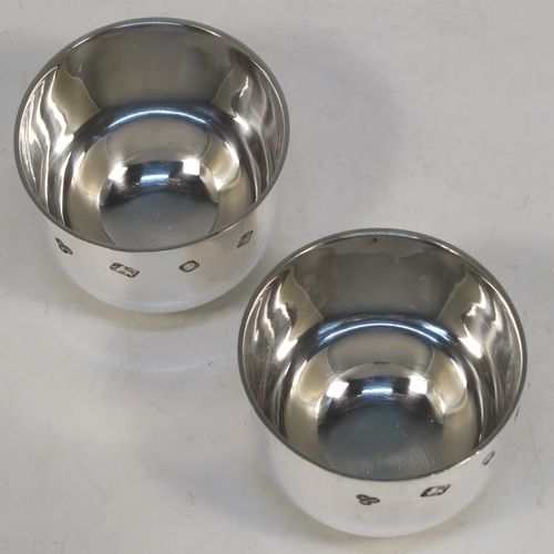 A very handsome and heavy pair of Sterling Silver tumbler cups, having plain round bodies. These beautiful silver tumbler cups were made by Payne and Son of London in 1983. The dimensions of these fine hand-made silver tumbler cups are height 5 cms (2 inches), diameter 6.5 cms (2.5 inches), and their total weight is approx. 356g (11.5 troy ounces).