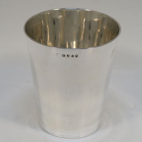 An elegant Antique Georgian Sterling Silver beaker, having a very plain round body with tapering sides,  and sitting on a flat base. This handsome silver beaker was made by Peter and Anne Bateman of London in 1795. The dimensions of this fine hand-made antique silver beaker are height 10 cms (4 inches), diameter at top 9 cms (3.5 inches), and it weighs approx. 168g (5.4 troy ounces).   