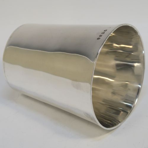 An elegant Antique Georgian Sterling Silver beaker, having a very plain round body with tapering sides, and sitting on a flat base. This handsome silver beaker was made by Peter and Anne Bateman of London in 1795. The dimensions of this fine hand-made antique silver beaker are height 10 cms (4 inches), diameter at top 9 cms (3.5 inches), and it weighs approx. 168g (5.4 troy ounces).
