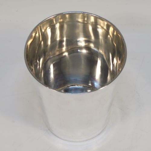 An elegant Antique Georgian Sterling Silver beaker, having a very plain round body with tapering sides, and sitting on a flat base. This handsome silver beaker was made by Peter and Anne Bateman of London in 1795. The dimensions of this fine hand-made antique silver beaker are height 10 cms (4 inches), diameter at top 9 cms (3.5 inches), and it weighs approx. 168g (5.4 troy ounces).