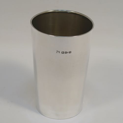 A handsome Antique Victorian Sterling Silver beaker cup, having a very plain round body with tapering sides, a gold-gilt interior, and sitting on a flat base. This elegant antique silver beaker was made by Nathan and Hayes of Chester in 1895. The dimensions of this fine hand-made antique silver beaker cup are height 11cms (4.25 inches), diameter at top 7 cms (2.75 inches), and it weighs approx. 115g (3.7 troy ounces).   