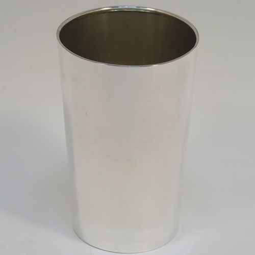 A handsome Antique Victorian Sterling Silver beaker cup, having a very plain round body with tapering sides, a gold-gilt interior, and sitting on a flat base. This elegant antique silver beaker was made by Nathan and Hayes of Chester in 1895. The dimensions of this fine hand-made antique silver beaker cup are height 11cms (4.25 inches), diameter at top 7 cms (2.75 inches), and it weighs approx. 115g (3.7 troy ounces).