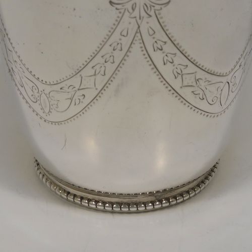A beautiful Antique Victorian Sterling Silver beaker, having a round body with tapering sides, with hand-engraved floral and swag decoration, a gold-gilt interior, and all sitting on a collet foot with an applied bead-edged border. This very pretty silver beaker was made in Sheffield in 1874. The dimensions of this fine hand-made antique silver beaker are height 11 cms (4.25 inches), diameter at top 8 cms (3.25 inches), and it weighs approx. 170g (5.5 troy ounces).